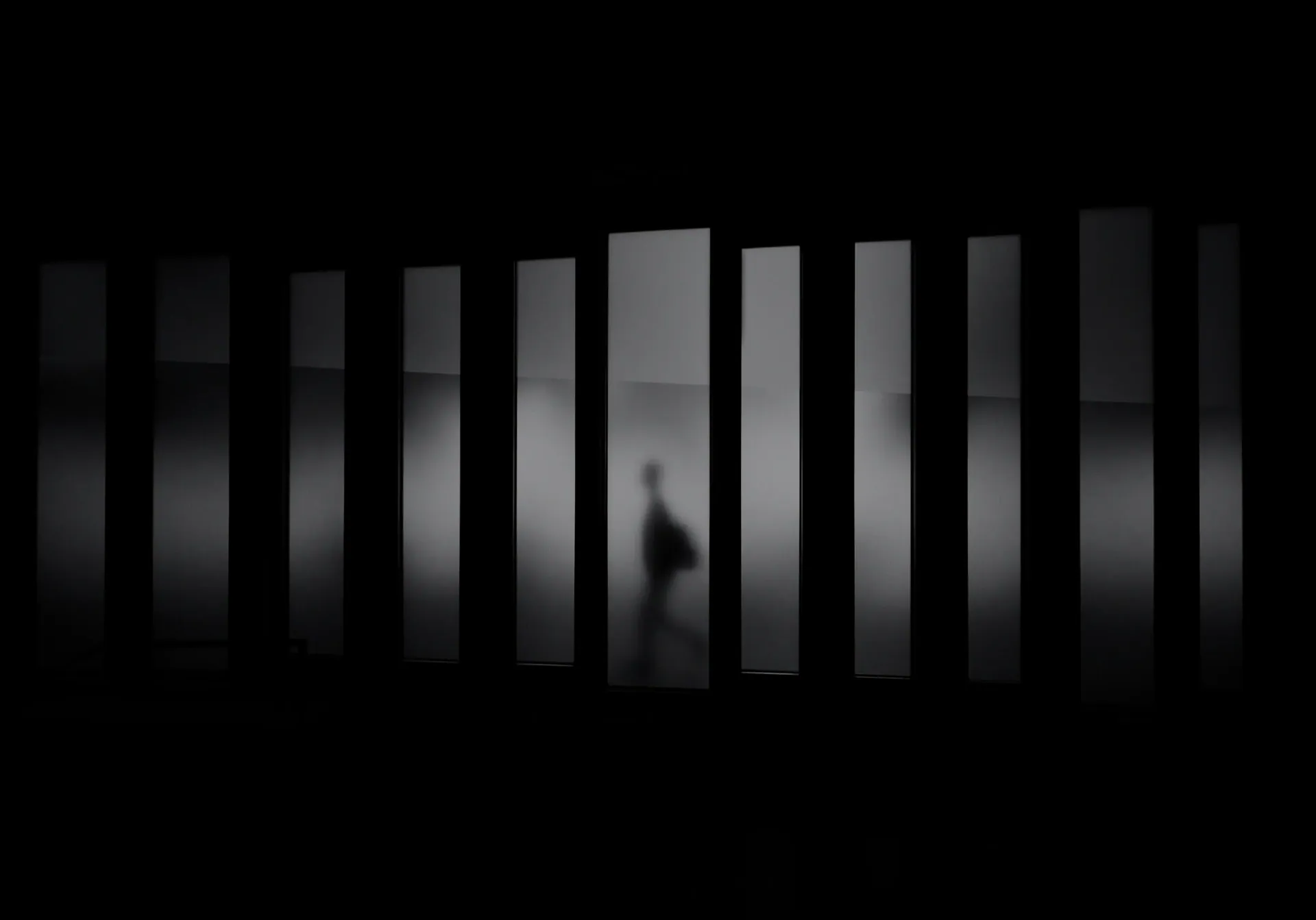 A figure crossing a luminous threshold